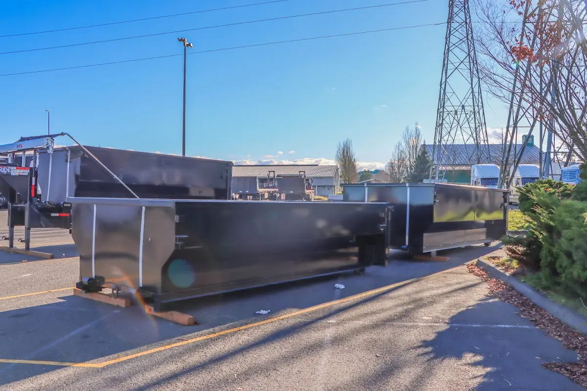 Roll-off dumpster ready for waste disposal at job site for Demolition Dumpster Rental in Monroe